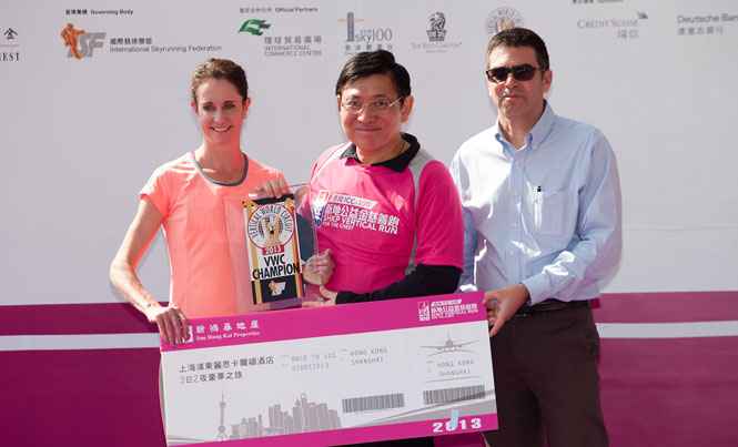 Suzy Walsham, race winner and 2013 Vertical World Champion receives her prize and trophy from Raymond Kwok, Event Chairman and Michel Holdara (ISF). ©Sporting Republic