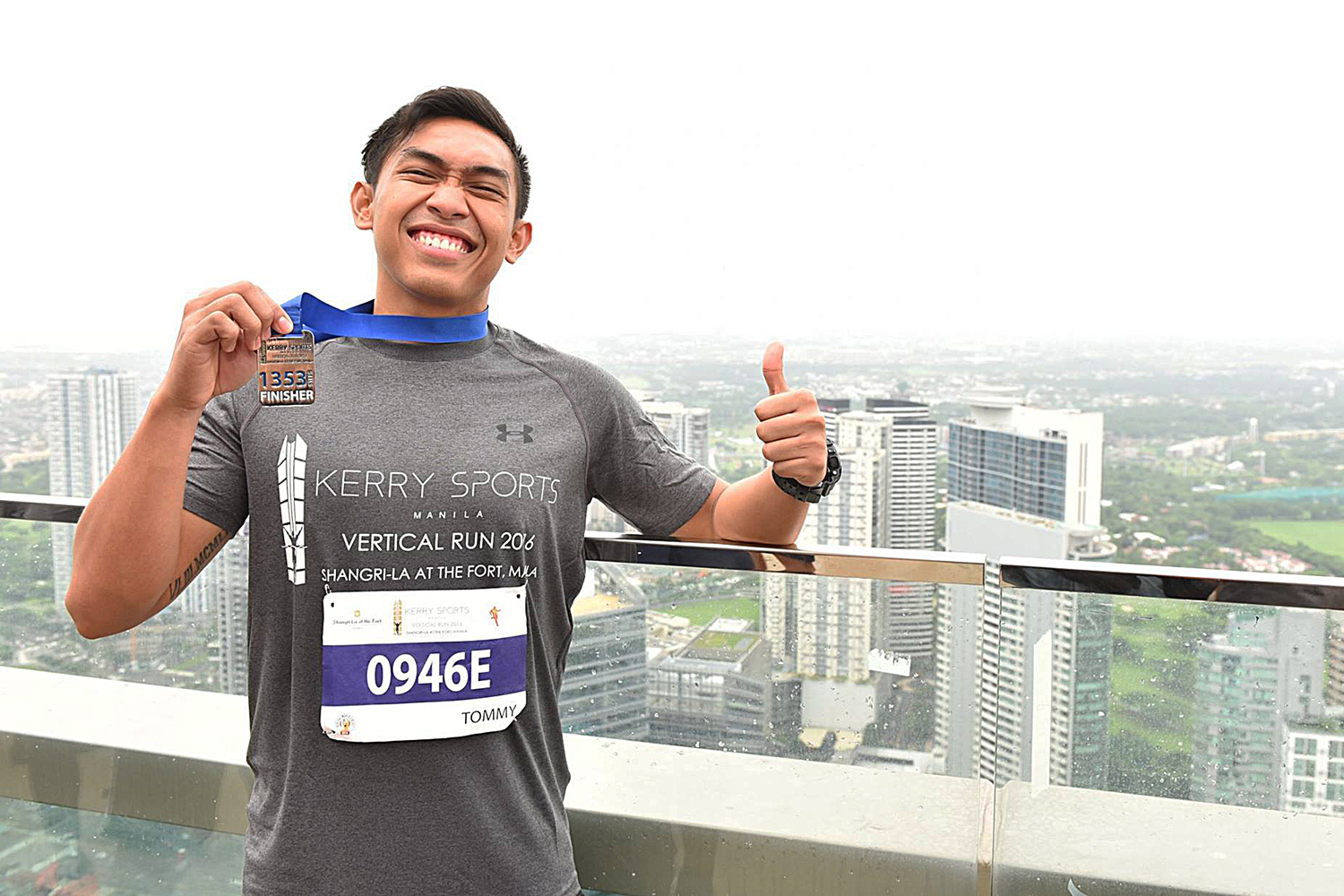 A happy finisher with a view at the Kerry Sports Manila Vertical Run 